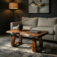 Live edge coffee table with a carved rosette inlay in a living room at golden hour