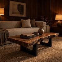 Live edge coffee table on two slab legs with arched cutouts in an evening living room with walnut wall paneling