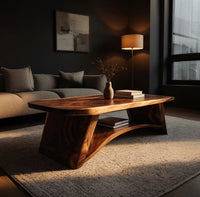 Live edge coffee table with sculpted legs and a low shelf in a living room at golden hour