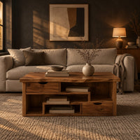 Live edge coffee table with staggered open shelves and two small drawers in a dark living room at golden hour