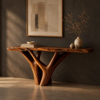 Console table with a live edge slab top on a branching trunk base, three-quarter view showing the grain