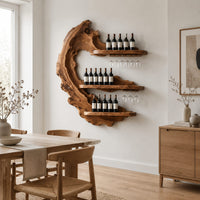 Live edge crescent wine rack with three shelves and rails for hanging stemware in a Scandinavian dining room with white walls