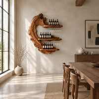 Live edge crescent wine rack with three shelves and rails for hanging stemware in a bright open plan dining room