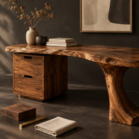 Corner detail of live edge desk with a tree trunk leg that rises into three shelves beside wood, brass and linen samples