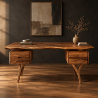 Live edge desk with drawer pods on forked legs in a dark studio against a charcoal plaster wall