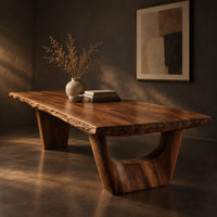 Live edge dining table on two sculpted arch pedestals, three-quarter view showing the grain
