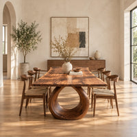 Live edge dining table on a large open ring pedestal base in a bright open plan dining room