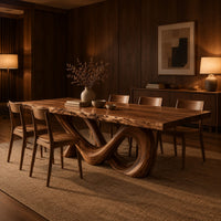 Live edge dining table with a looping figure eight base in an evening dining room with walnut wall paneling