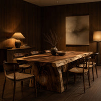 Live edge dining table with a thick slab top and tapered block base in an evening dining room with walnut wall paneling