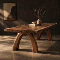 Live edge dining table with a thick slab top and two arched legs, three-quarter view showing the grain