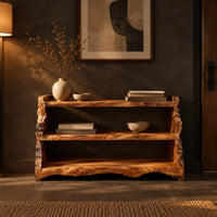 Open shoe shelf with three tiers and natural live edge sides in a dark entryway at golden hour