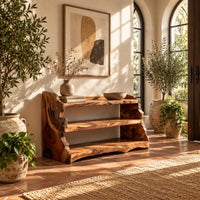 Open shoe shelf with three tiers and natural live edge sides in a bright entryway with arched windows and plants