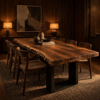 Live edge slab dining table on two dark squared frame legs in an evening dining room with walnut wall paneling
