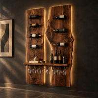 Two tall wood slab panels with slim dark pegs and a shelf for glasses, three-quarter view showing the grain
