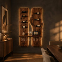 Two tall wood slab panels with slim dark pegs and a shelf for glasses in a dark dining room at golden hour