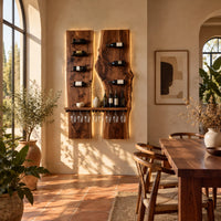 Two tall wood slab panels with slim dark pegs and a shelf for glasses in a bright dining room with arched windows and plants
