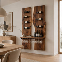 Two tall wood slab panels with slim dark pegs and a shelf for glasses in a Scandinavian dining room with white walls