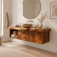 Floating vanity with live edge top, open cubby, two drawers and a door in a Scandinavian bathroom with white walls