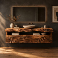Wall hung cabinet with live edge top, open shelf and wave carved front in a dark studio against a charcoal plaster wall