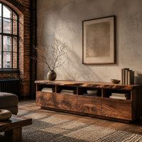 Live edge tv stand with four open cubbies above swirling grain front panels in an industrial loft living room with exposed brick