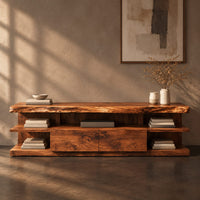 Corner detail of live edge tv stand with open end shelves and two flush center panels beside wood, brass and linen samples