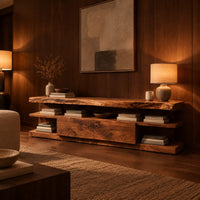 Live edge tv stand with open end shelves and two flush center panels in an evening living room with walnut wall paneling