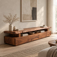 Live edge tv stand with a raised slab top and an open display gap in a Scandinavian living room with white walls