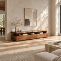 Live edge tv stand with a raised slab top and an open display gap in a bright open plan living room