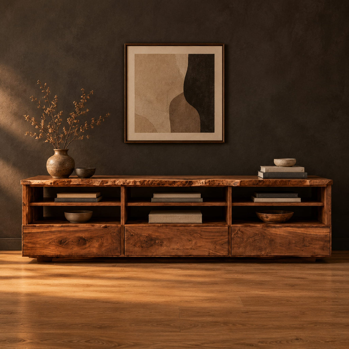 Live edge tv stand with three open shelf bays and lower front panels in a dark studio against a charcoal plaster wall