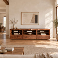 Live edge tv stand with three open shelf bays and lower front panels in a bright open plan living room