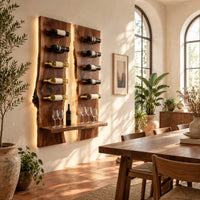 Wine rack of two tall live edge slabs with angled bottle pegs in a bright dining room with arched windows and plants