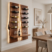 Wine rack of two tall live edge slabs with angled bottle pegs in a Scandinavian dining room with white walls