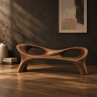 Long wood bench with a pinched middle and two oval openings, three-quarter view showing the grain