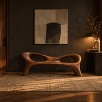 Long wood bench with a pinched middle and two oval openings in a dark entryway at golden hour