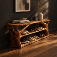 Long low shoe bench with open shelves and branching sculpted sides, three-quarter view showing the grain