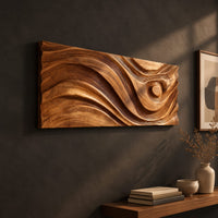 Long horizontal wall panel carved with sweeping waves and a raised disc, three-quarter view showing the carved depth