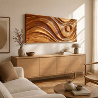 Long horizontal wall panel carved with sweeping waves and a raised disc above a light oak sideboard in daylight