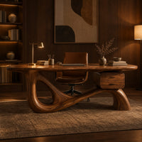 Desk with an oval top, a looped sculpted base and a two drawer box in an evening home office with walnut wall paneling