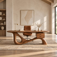 Desk with an oval top, a looped sculpted base and a two drawer box in a bright open plan home office