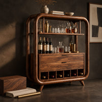 Corner detail of bar cabinet with a looped wood frame, open shelf and slotted base beside wood, brass and linen samples
