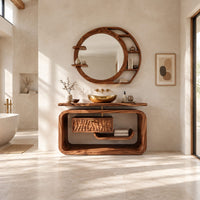 Vanity cabinet in a looped wood frame with a carved wave drawer front in a bright open plan bathroom