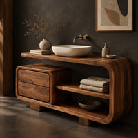 Corner detail of bathroom vanity with a looped frame, two stacked drawers and an open shelf beside wood, brass and linen samples