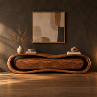 Loop framed tv stand with a ripple carved four panel front in a dark studio against a charcoal plaster wall