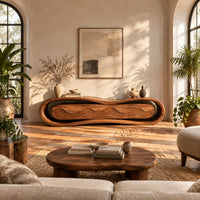 Loop framed tv stand with a ripple carved four panel front in a bright living room with arched windows and plants