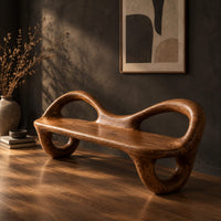 Bench with a flat plank seat, looped arms and ring shaped legs, three-quarter view showing the grain