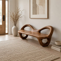 Bench with a flat plank seat, looped arms and ring shaped legs in a Scandinavian entryway with white walls
