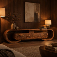 Tv stand inside a looped wooden frame with an ocean wave carved front in an evening living room with walnut wall paneling