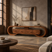 Tv stand inside a looped wooden frame with an ocean wave carved front in an industrial loft living room with exposed brick