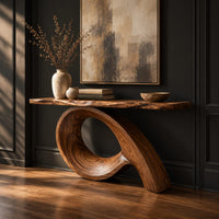 Narrow console table with a live edge top on a sweeping looped base, three-quarter view showing the grain