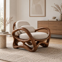 Wooden chair with a looping ribbon frame and an interlaced base in a Scandinavian living room with white walls